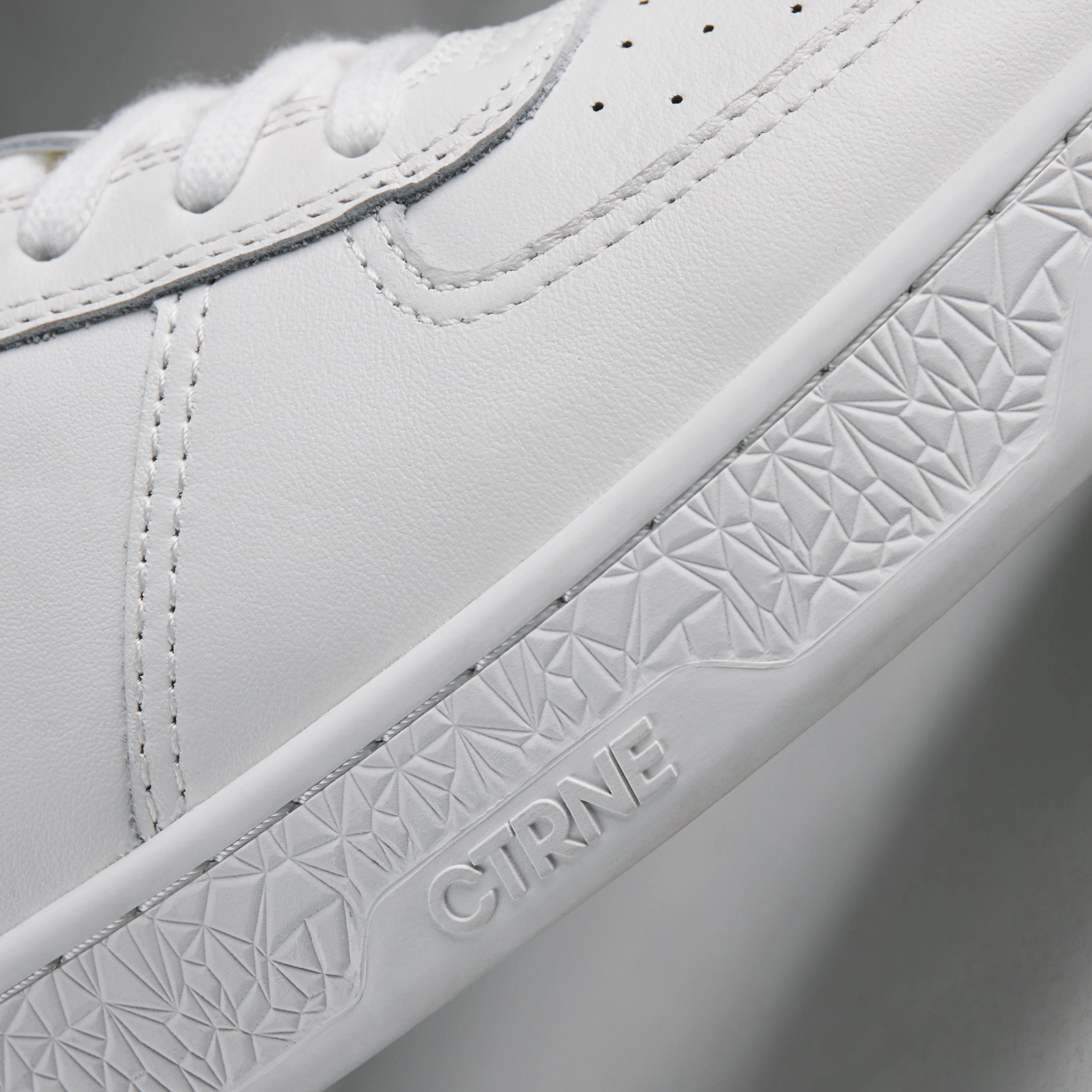 CTRNE white leather sneaker close-up detail